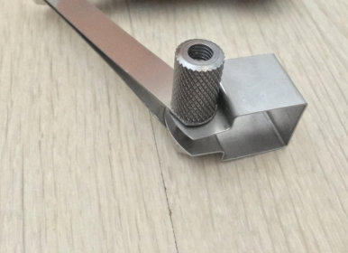 Metal Bracket with knurled cylindrical elongated nut